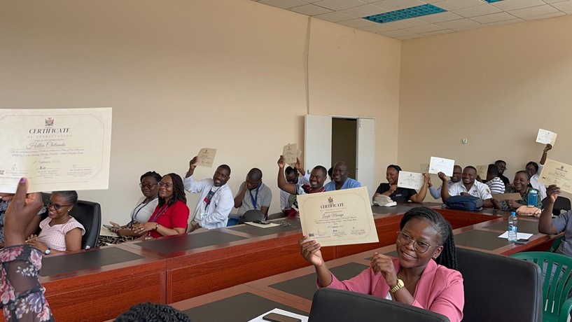 Proud trainees holding up their awarded certificates of completion of the very first POCUS bootcamp training and assessments in Zambia