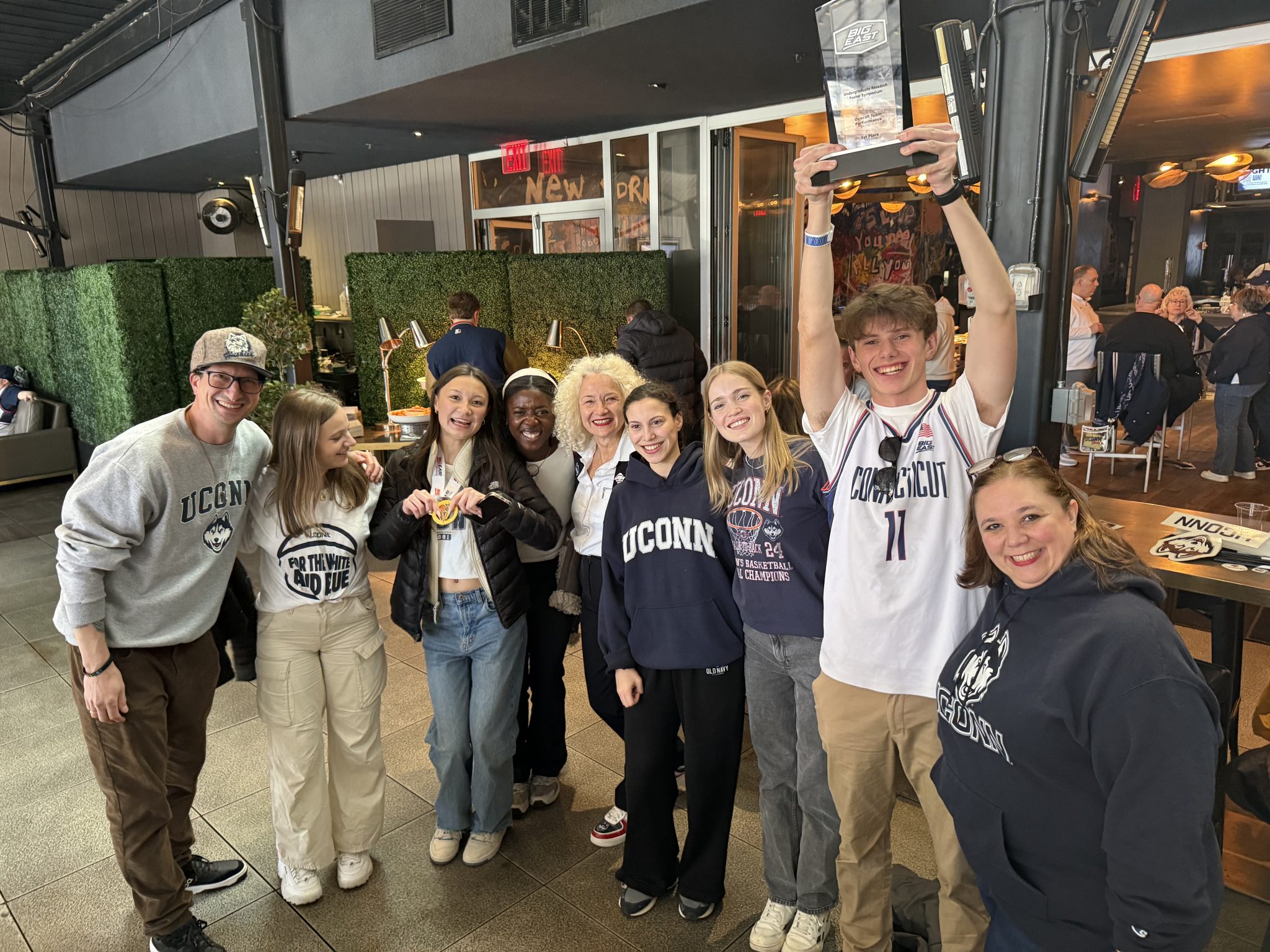 UConn's team at the Big East Undergraduate Research Symposium earned top honors. From left: Office of Undergraduate Research Director Micah Heumann, and Katarina Kalajzic ’26, Hailey DeWalt '26, Ademide Ogunsina '26, UConn President Radenka Maric, Malak Nechnach '26, Anja Kearney ’26, Wyeth Haddock '26, Vice Provost and Honors Program Director Jennifer Lease Butts. (Contributed photo)