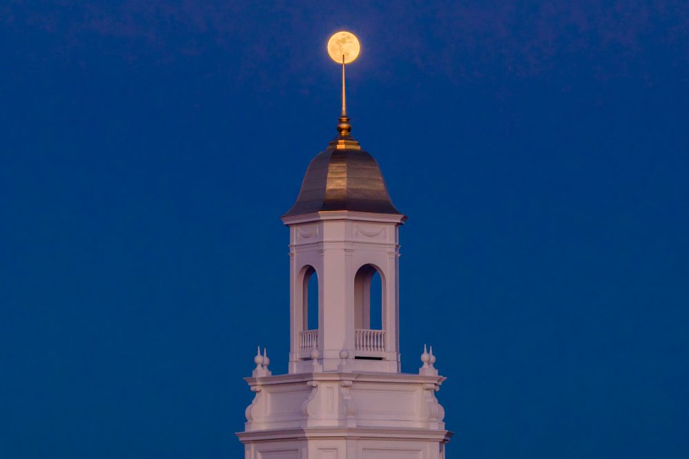 The full moon in March, also known as the Worm Moon, rises behind the Wilbur Cross cupola
